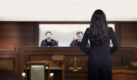 attorney,woman,on,courtroom,talking,to,magistrate,in,court,box.